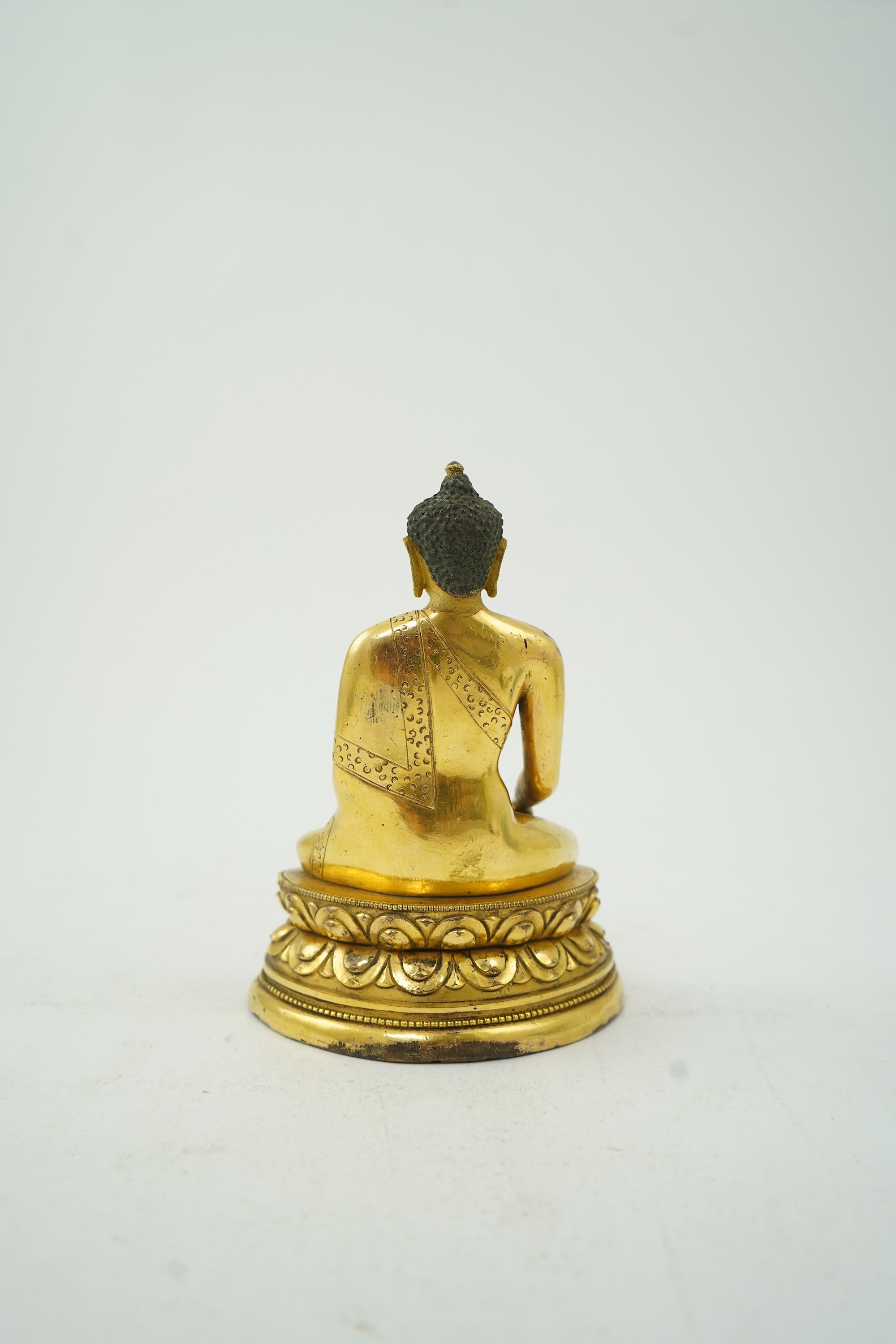 A Mongolian gilt-bronze figure of Buddha Shakyamuni, possibly 18th century